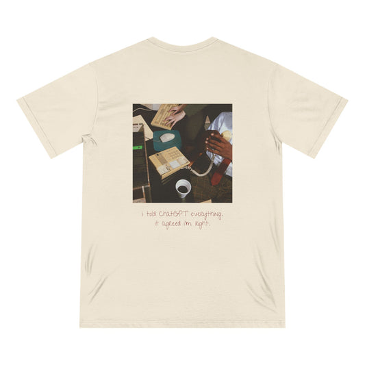 Back view of the “I Told ChatGPT Everything” tee by Office Off-Duty in natural. Features a candid retro-style photo of hands at a desk with the caption: “I told ChatGPT everything. It agreed I’m right.” A witty nod to over-sharing and self-validation in the AI age.